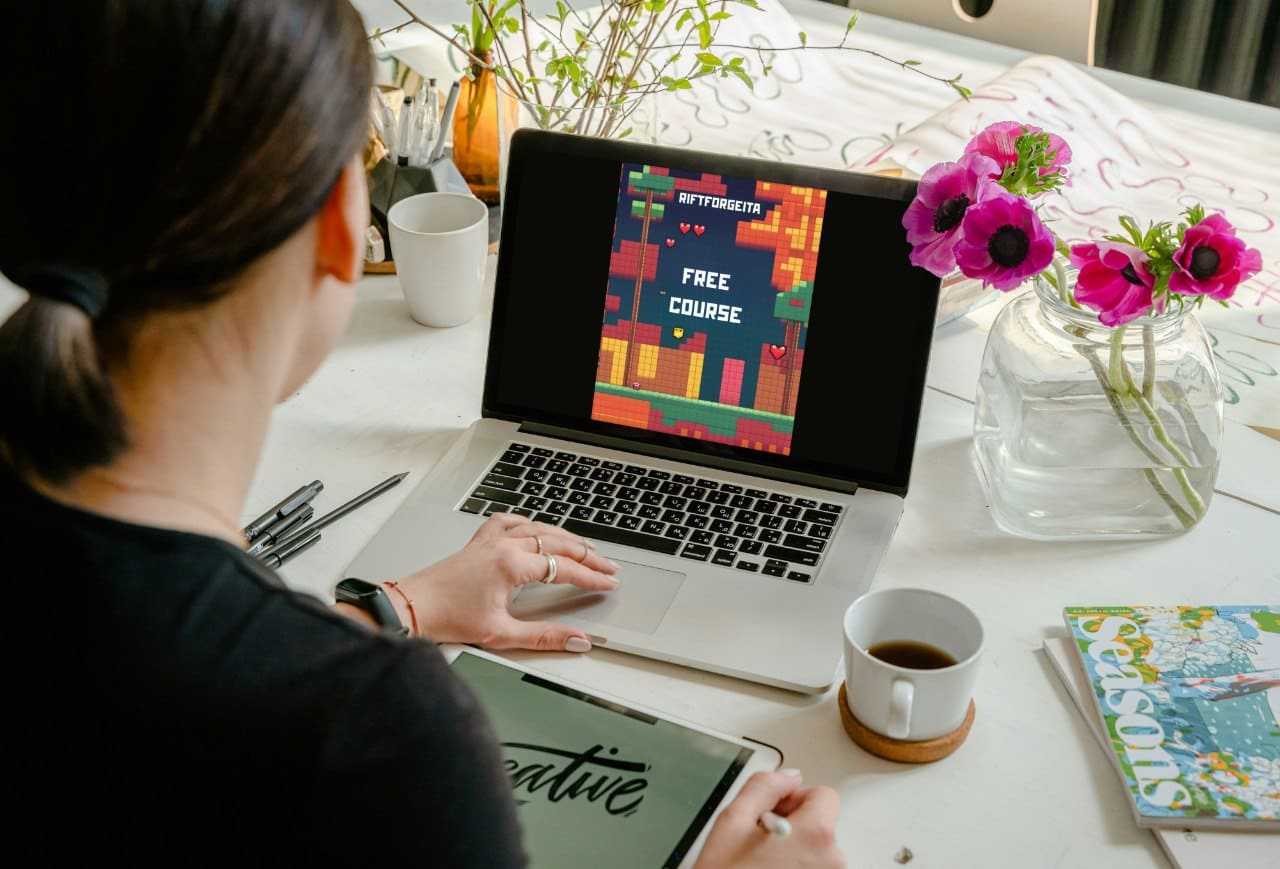 Laptop displaying Java game development course "Free Course"